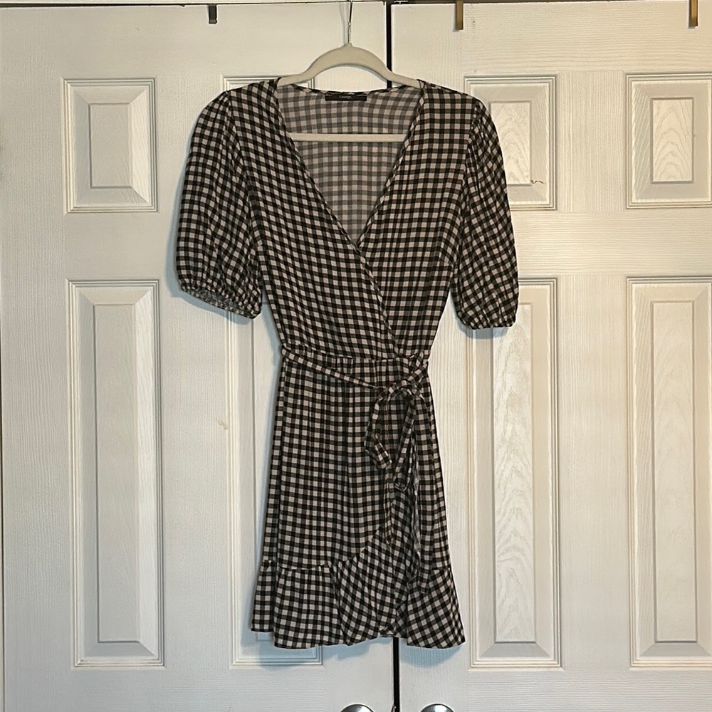 Black and White plaid tea dress with frill on hem. Size 6.